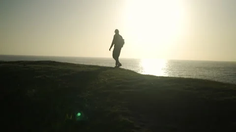 Man hiking close to big cliffs and heavy ocean in Basque Coast, Spain Video stock 154776753