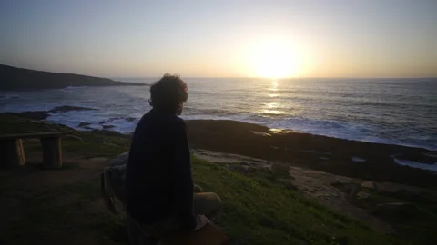 Man hiking close to big cliffs and heavy ocean in Basque Coast, Spain Video stock 154777322