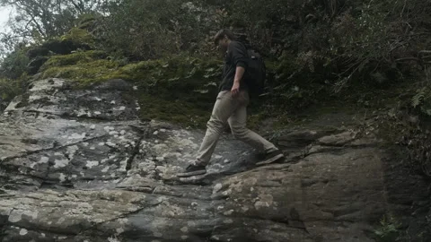 Man hiking in the forest to find a spot to fly his drone. Actually finds a spot Stock Footage 243418989