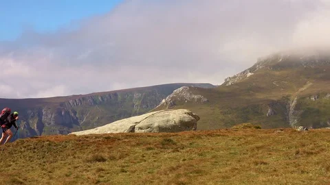 Man hiking high in the mountains Stock Footage 95082335