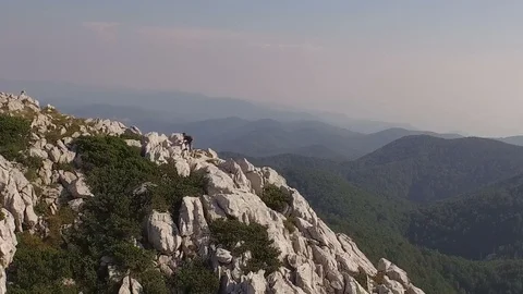 Man is hiking on a mountain 動画素材 99423596