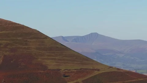 Man hiking up mountain with his 2 dogs from Above, Dragons Back Brecon Beacons Stock-Footage 321194508