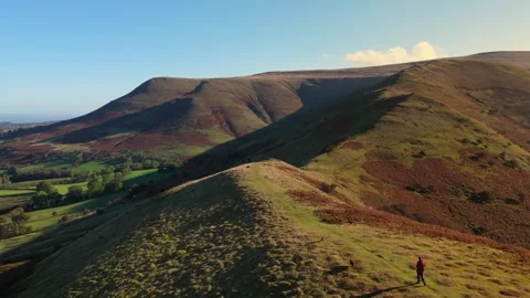 Man hiking up mountain with his 2 dogs from Above, Dragons Back Brecon Beacons Stock-Footage 321194552