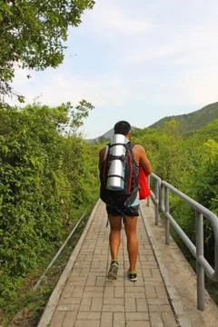 Man hiking in mountain path Stock Photos