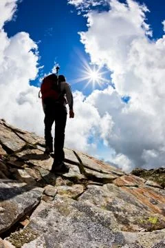 Man hiking up mountain Stock Photos