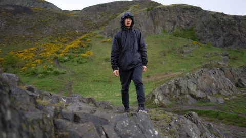 Man Hiking on Mountain Ridge Alone While Raining - Active Lifestyle Stock Footage 118964633
