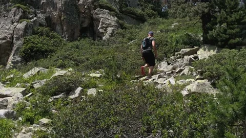 Man hiking in the mountains Stock Footage 158969787