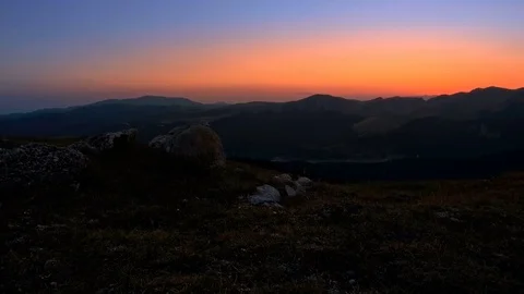 Man hiking at sunset in mountains Stock-Footage 79435195