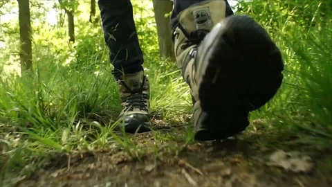 Man Hiking through Nature. Low Angle Boots Walking through Forest Woodland Stock Footage 111237131