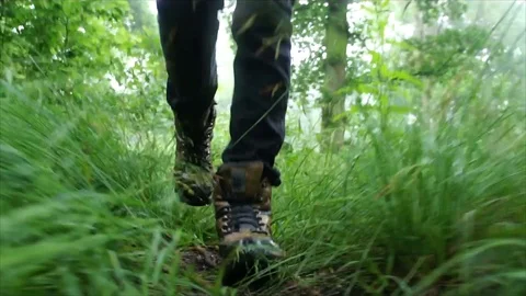 Man Hiking through Nature. Low Angle Boots Walking through Forest Woodland Stock Footage 111237373