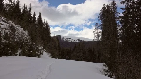 Man hiking in the winter mountains Stock Footage 87220208