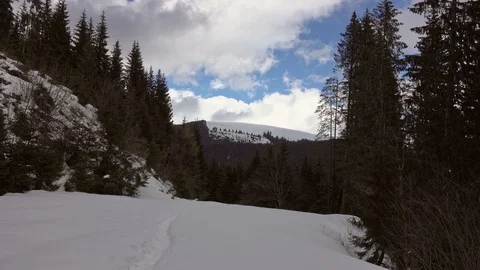 Man hiking in the winter mountains Stock Footage 87223143