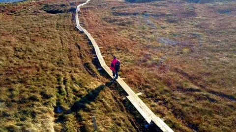 Man hillwaking in Ireland Stock Footage 70171670