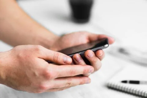 Man Hipster using smartphone a touch screen smart phone hands close up, vinta 스톡 사진