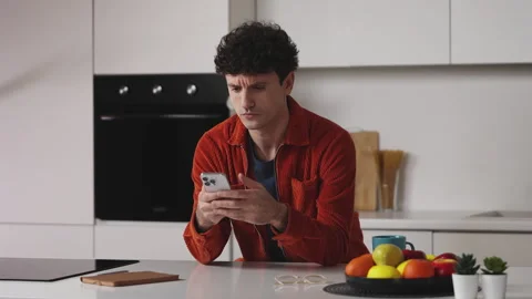 Man in his 30s texting on cellphone, receiving bad news message, work problems Stock Footage 341016757