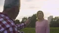 Man in his 50s photographing his beautiful wife in park at sunset, hobby, date HD Footage