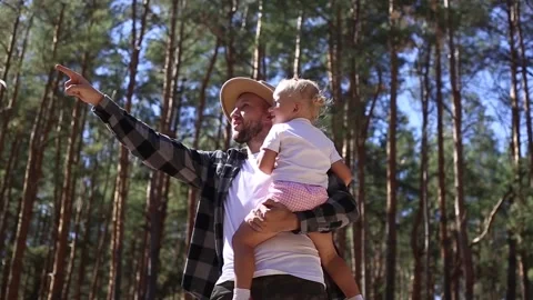 Man with his child while walking in the woods. Stock Footage 149946546