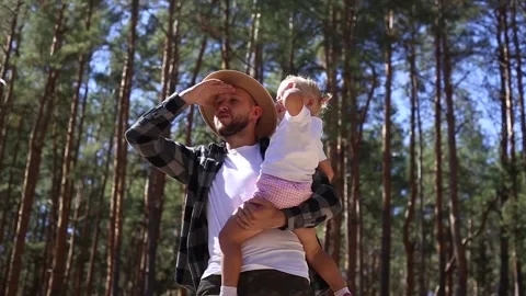 Man with his child while walking in the woods. Stock Footage 149946553