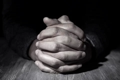 Man with his hands clasped Stock Photos