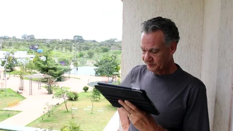 Man on his iPad Video stock 169723315