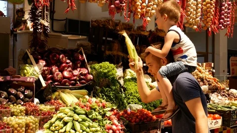 Man with his little son at the market Stock Footage