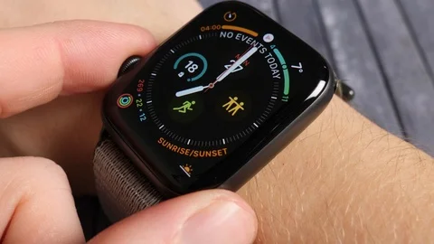 Man on his smart watch looking at his pulse heart rate, apple iwatch Stock Footage