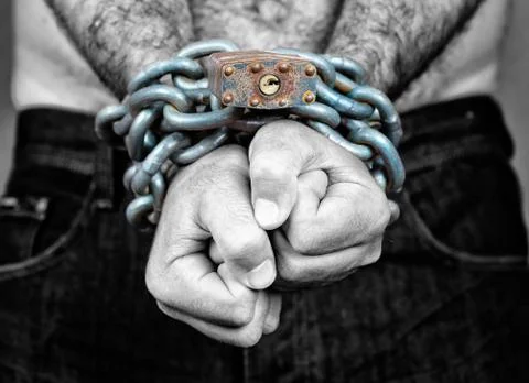 Man with his two hands chained Stock Photos