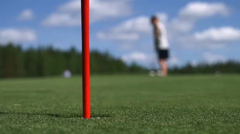 The man hits the Golf ball. Golf course Stockbeeldmateriaal 63775376