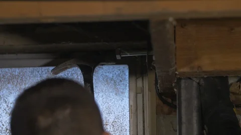 Man Hitting Bolt Above Head From Behind Video stock 100754417