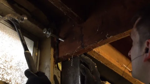 Man Hitting Bolt with Hammer Stock-Footage 100755254