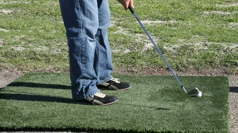 Man hitting iron at range Stock Footage 568519