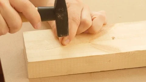 Man hitting nail by hammer Stock Footage 79073569