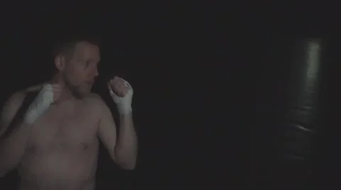 Man hitting punching bag slow motion Stock Footage 64223682