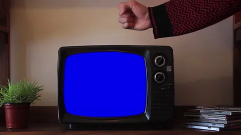 Man Hitting Retro TV Until Static Changes to Blue Screen, Close Up - 4K Stock Footage 316335766