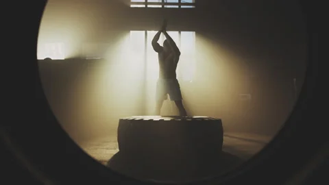 Man hitting tire with a hammer 스톡 동영상 236191674