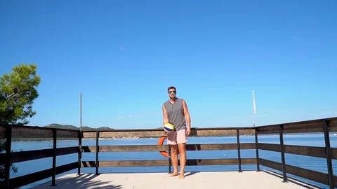 A man hitting a volleyball towards the camera in slowmotion 스톡 동영상 114823378