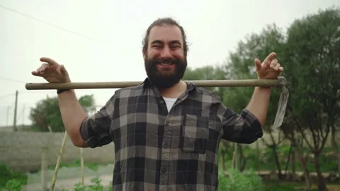 Man with hoe smiling at camera Video stock 171432052