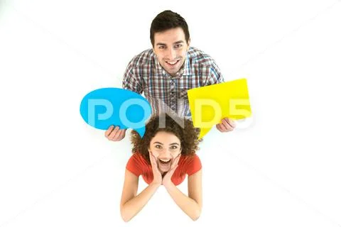 The man hold the dialog signs near the woman. View from above Stock Photos