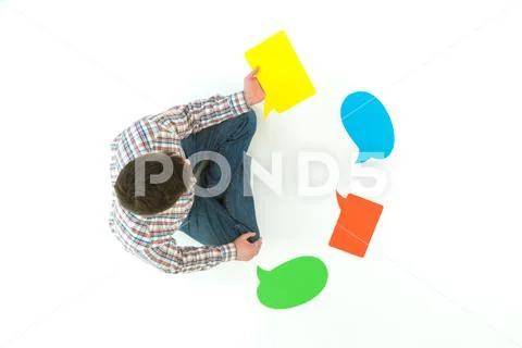 The man hold the dialog signs on the white background. View from above Stock Photos