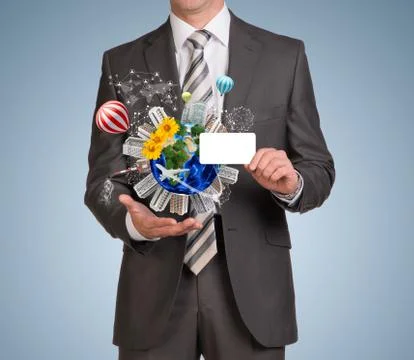Man hold empty card and Earth with buildings Foto stock