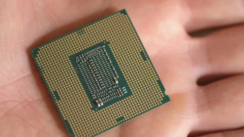Man hold an hi tech desktop pc cpu part,computer components chip shortage Stock Footage 214084220