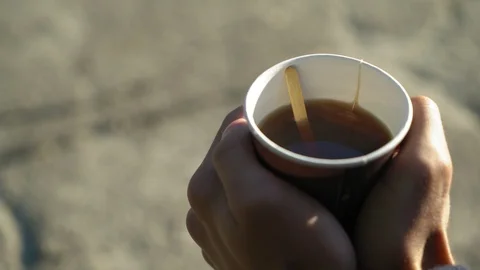 Man hold hot cup of tea in the morning outdoors, close up, 4k 2 Видео 95498074