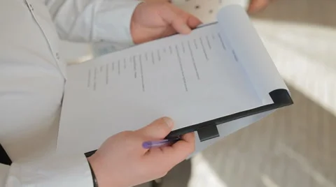 Man hold the plan of event on tablet Stock Footage 68189774