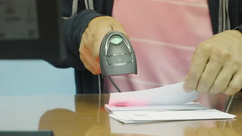 Man hold scanner and scan for reading barcode for transfer data to computer. Stock Footage 172342332