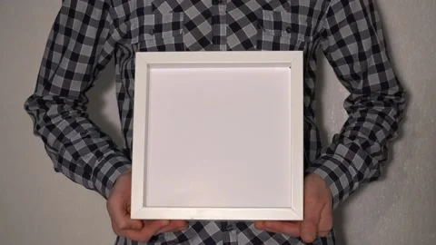 Man Hold White Frame Mock up Video stock 144376526