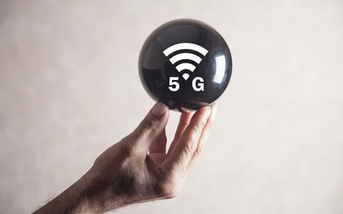 Man holding 5G network wireless systems on crystal ball. Stock Photos