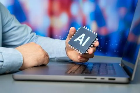 A man holding an AI enabled microchip. Implementing artificial intelligence.. 스톡 사진