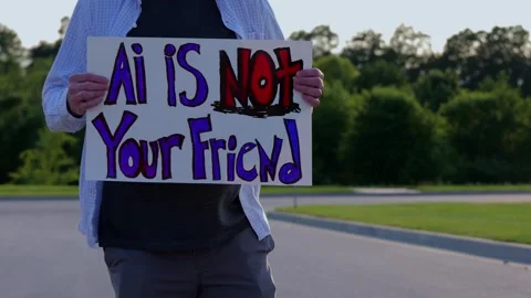 Man Holding AI Is Not Your Friend Protest Sign Stock Footage 337385022
