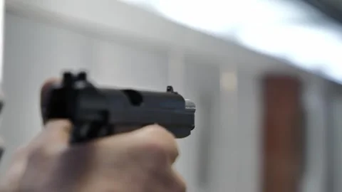 Man Holding and Loading and Charging and Shooting a Classic Handgun Stockbeeldmateriaal 286101257