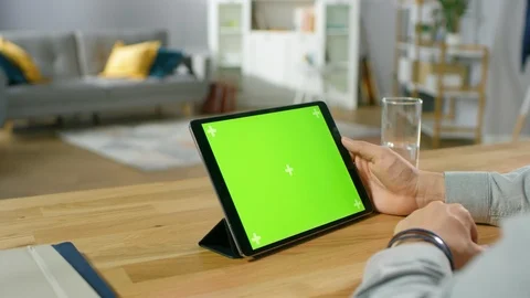 Man Holding and Watching Green Mock-up Screen Digital Tablet Computer Stock Footage